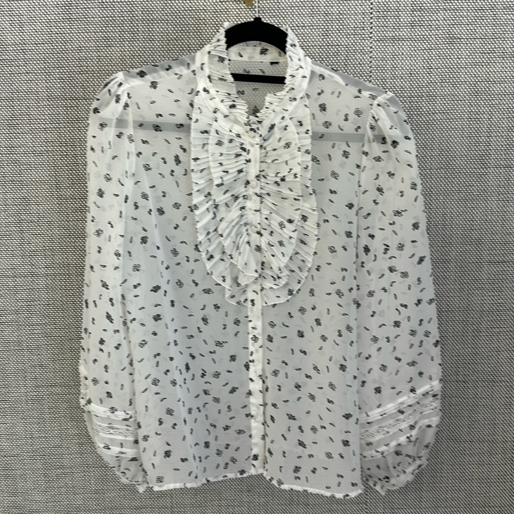 Sheer blouse with ruffle and lace detail and covered buttons